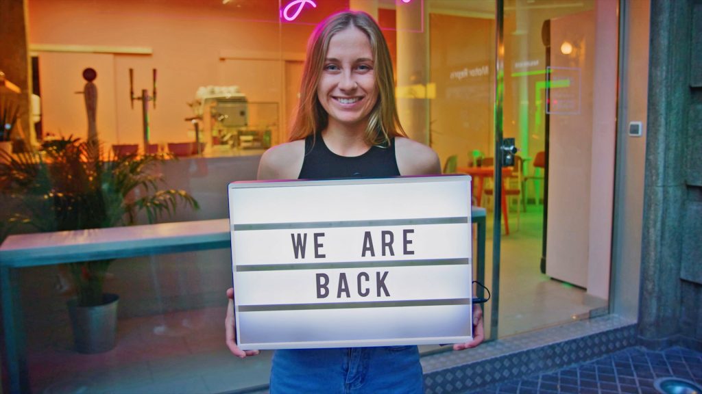 Woman holding up a sign