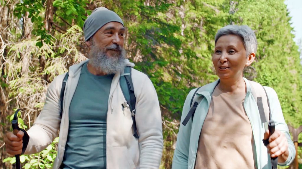 Two elderly people hiking