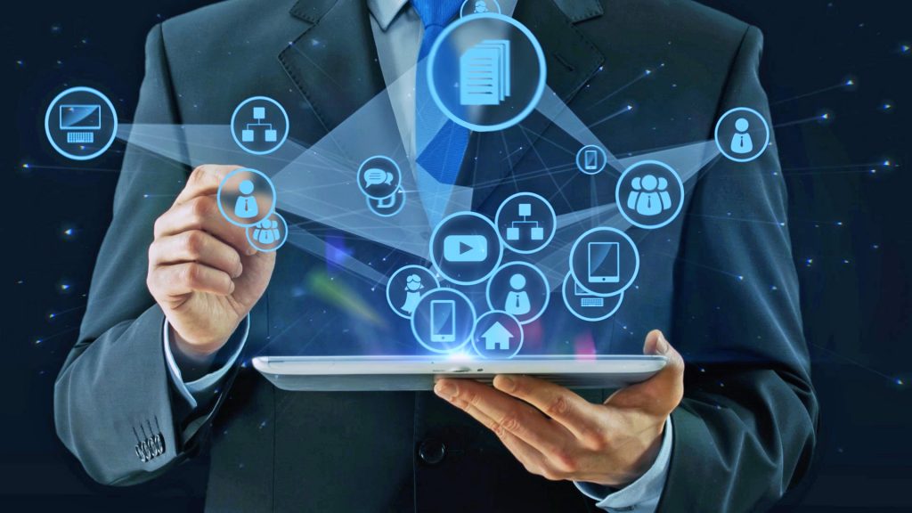 Man holding tablet with social media platforms icons