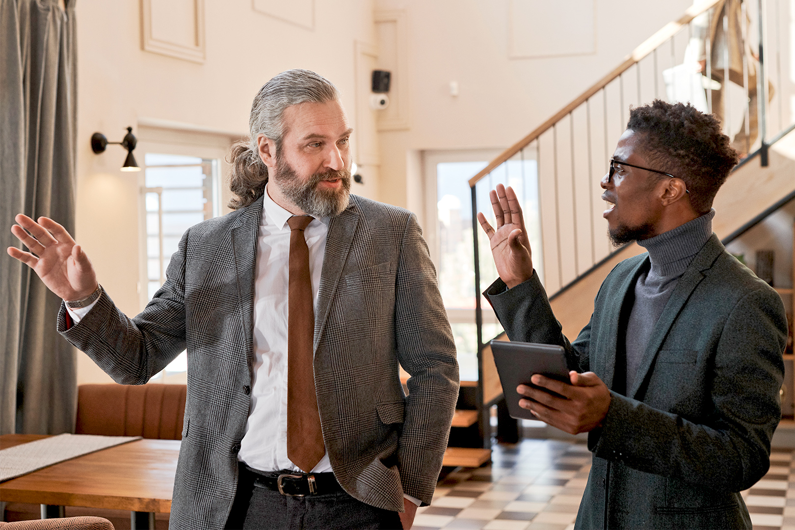 Two men discussing a future event