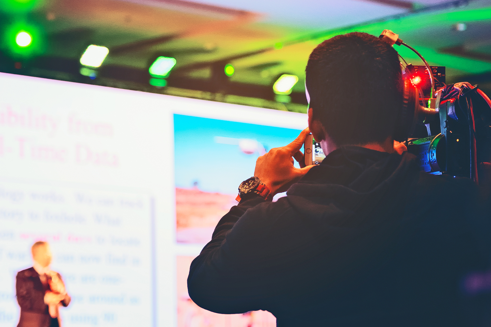 Camera person filming an event