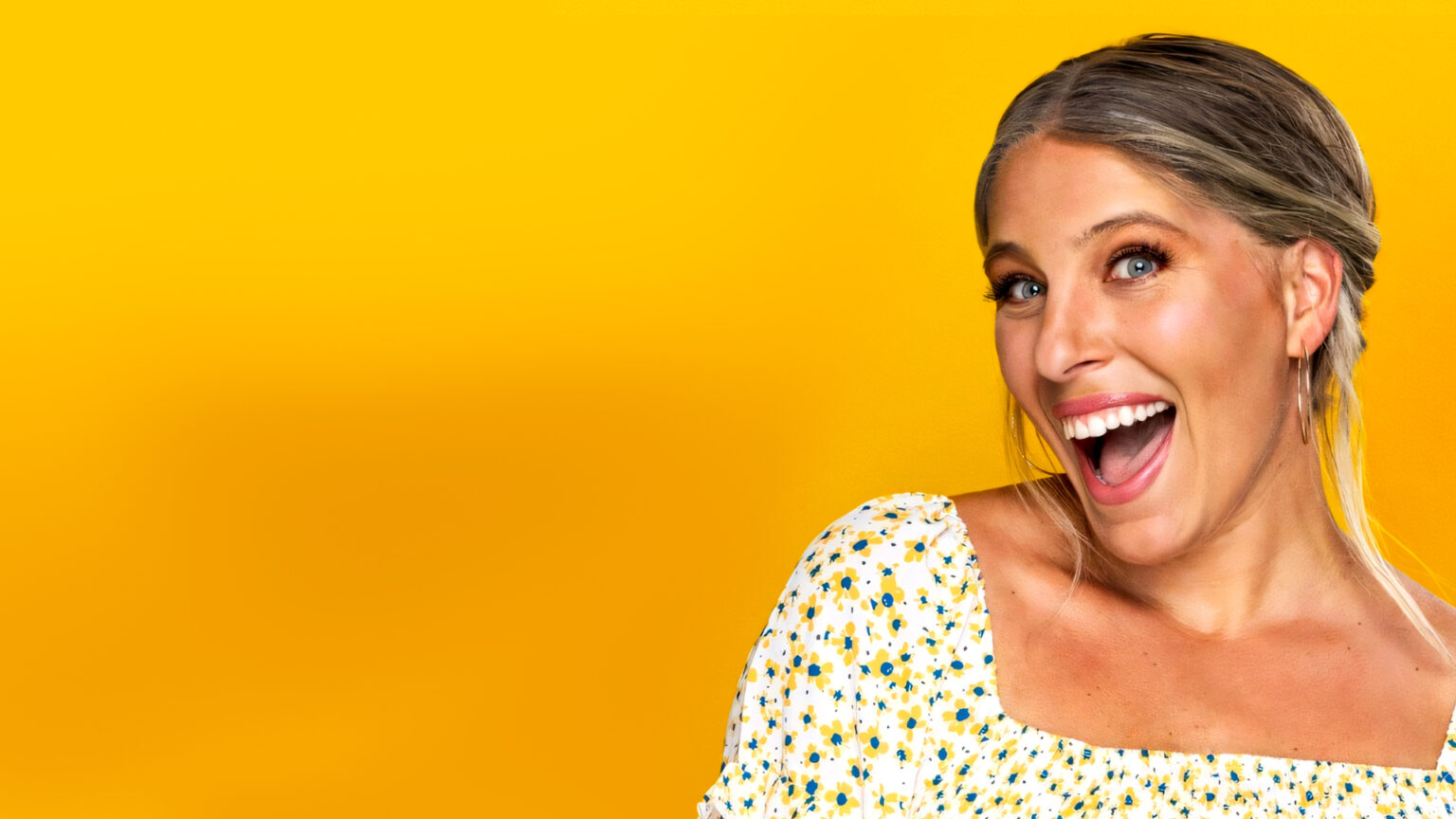 Jess Ekstrom, ambition expert and entrepreneur keynote speaker, smiling over a yellow background